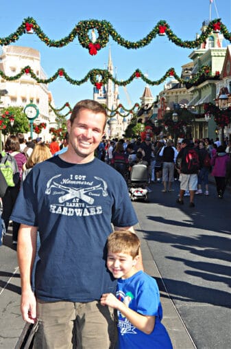 man and boy at disney world decorated for christmas