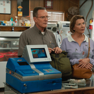 Man and woman standing in front of cash register