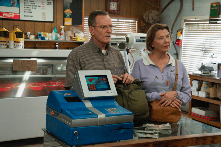 Man and woman standing in front of cash register