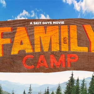 Family Camp sign in front of blue sky and trees