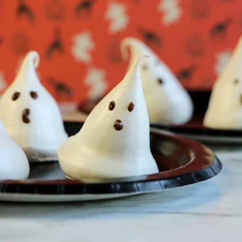 meringue ghosts on a plate vertical