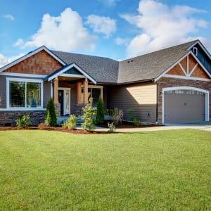 Modern one story home with grassy front yard