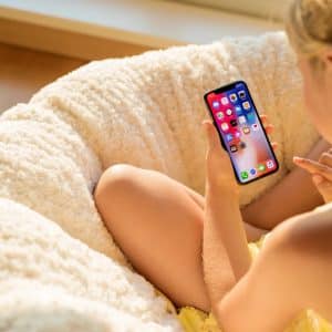 girl holding iphone x