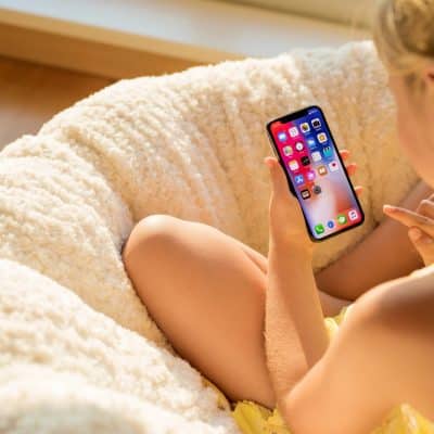 girl holding iphone x