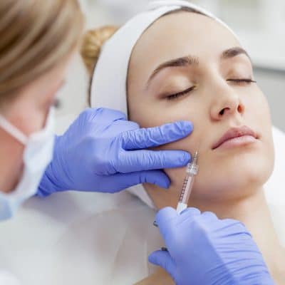 Woman in the beauty salon on the face treatment