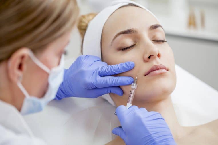 Woman in the beauty salon on the face treatment