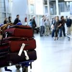 full luggage cart in airport terminal