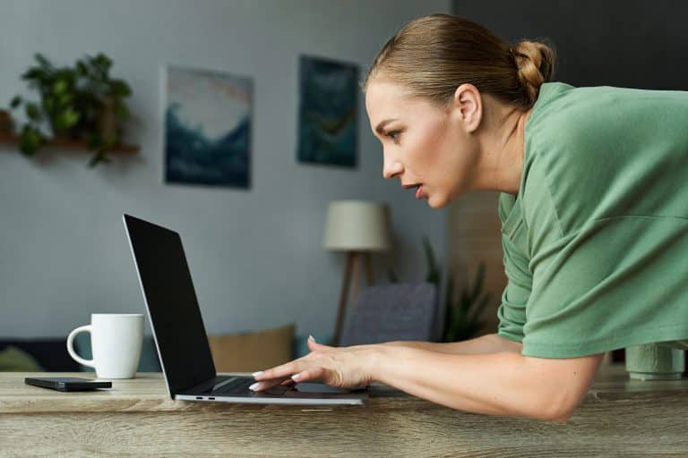 a woman researching on a laptop