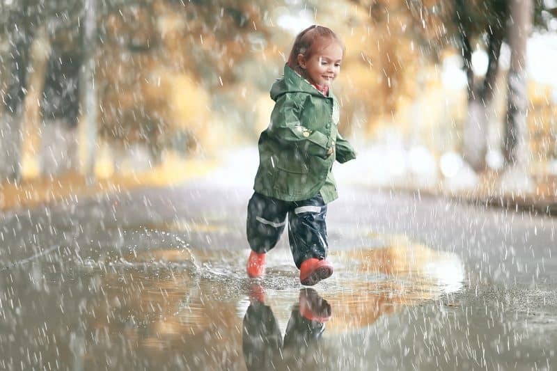 Little girl in rainy park