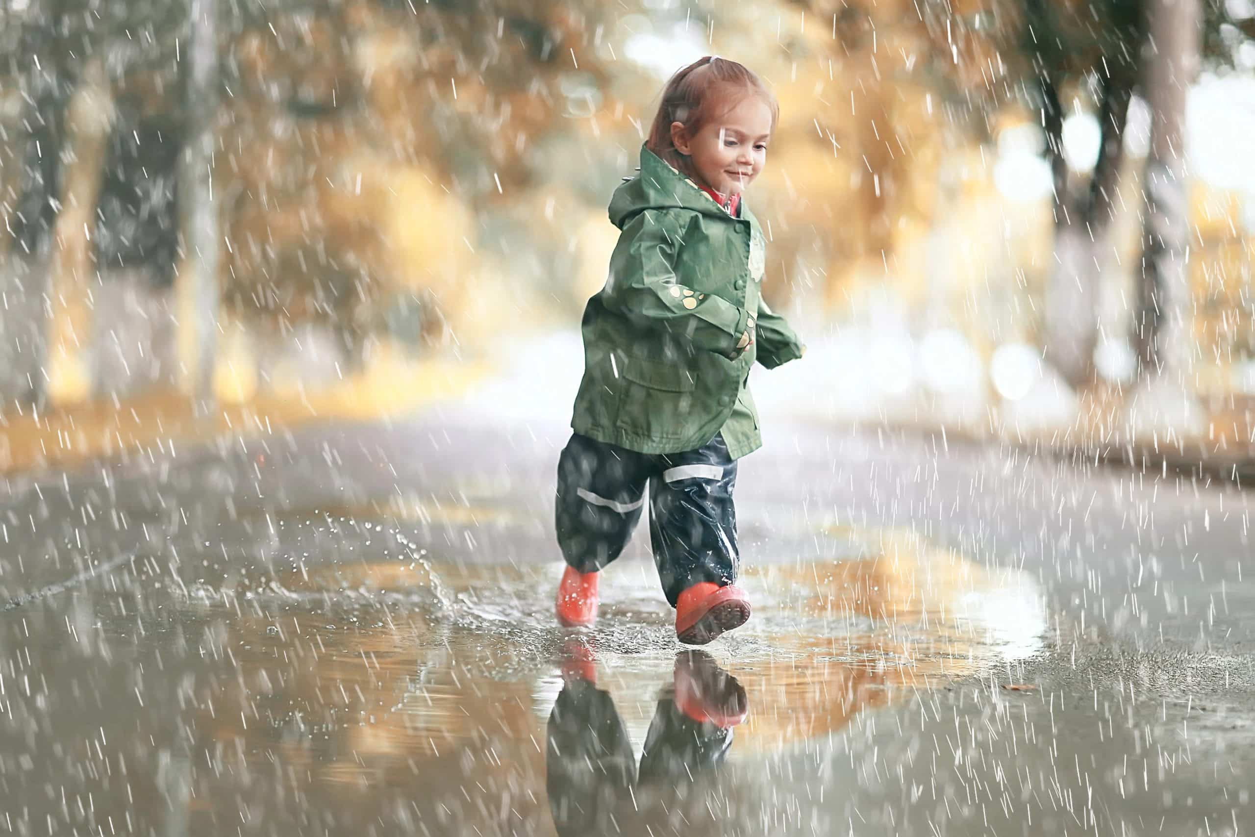 Little girl in rainy park