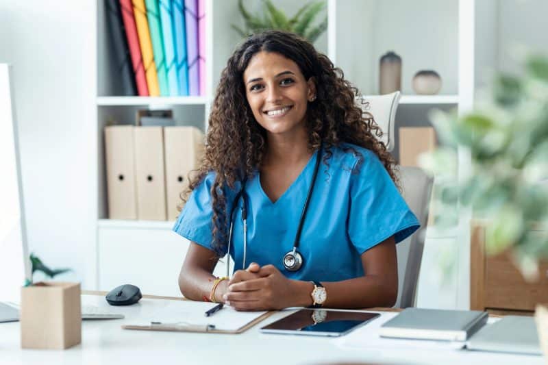 Shot of female nurse explaining medical treatment to patient through a video call with computer in the consultation. Shot Female Nurse Explaining Medical Treatment Patient Video Call Computer Consultation