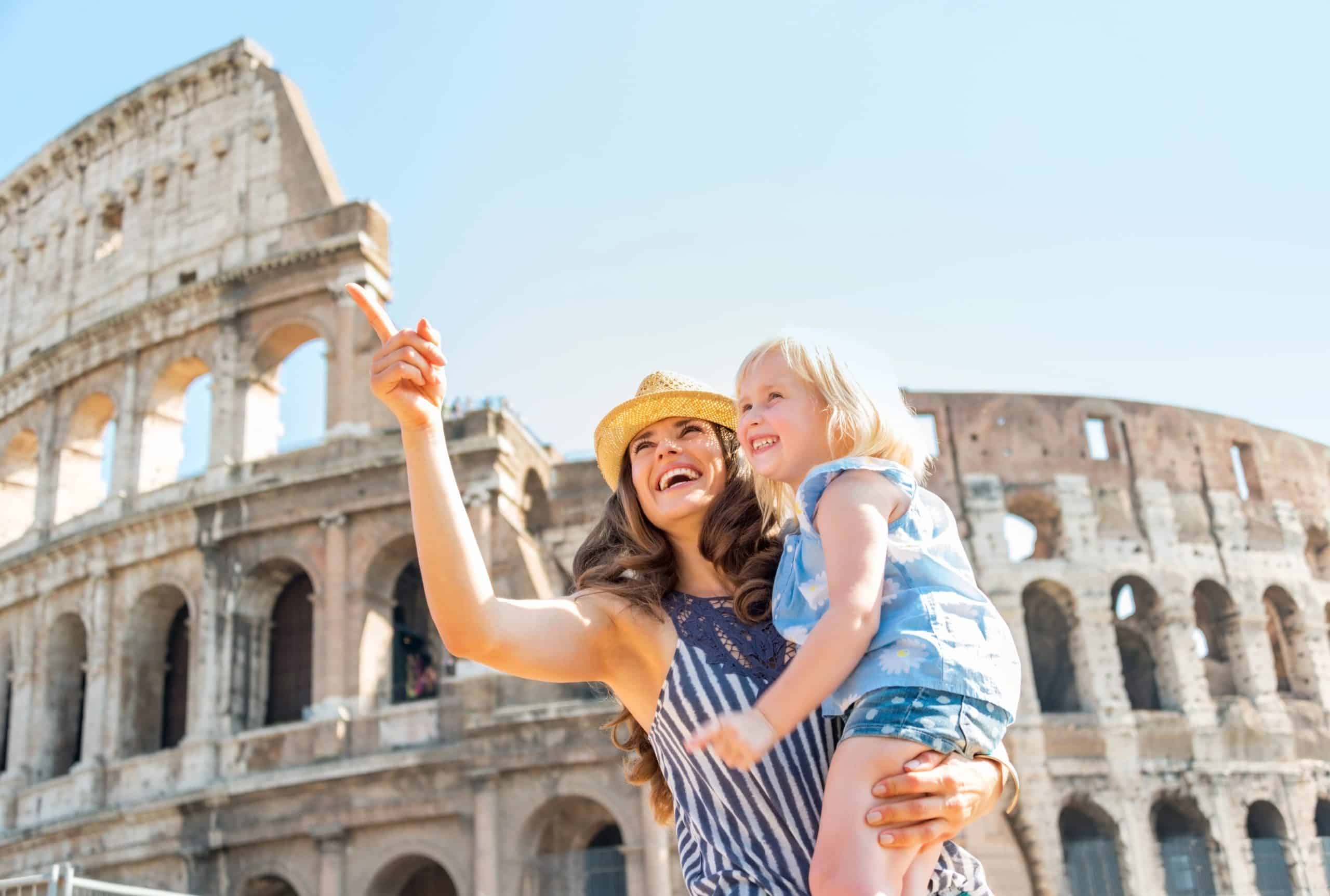 Happy mother and baby girl sightseeing near colosseum in rome, italy Happy mother and baby girl sightseeing near colosseum in rome,